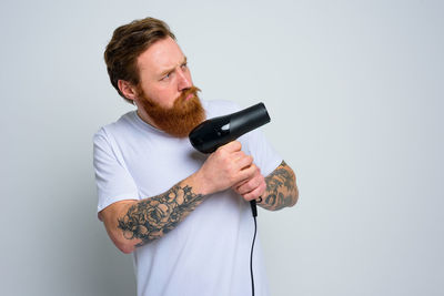 Man looking at camera over white background