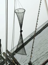 Low angle view of metallic structure against sky