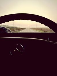 Close-up of car windshield against sky