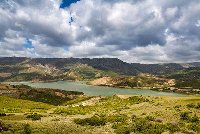 Scenic view of landscape and mountains against sky