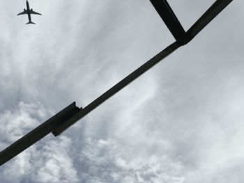 Low angle view of airplane flying in sky