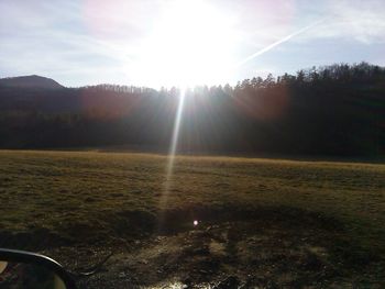 Sun shining over landscape