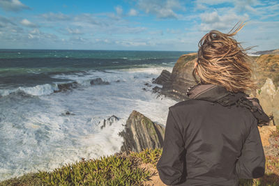 Rear view of woman on beach