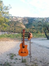 View of playing guitar on stage against sky