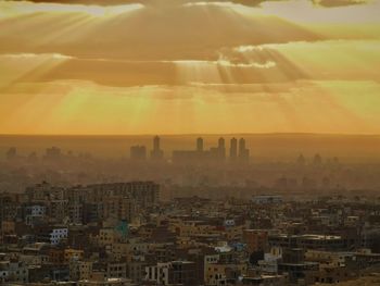 High angle view of townscape against sky during sunset