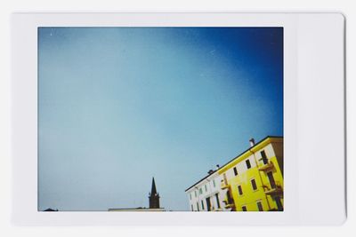 Low angle view of building against blue sky