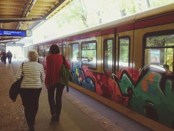 People at railroad station platform