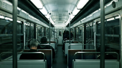 Rear view of passengers traveling in train