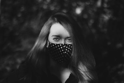 Portrait of a beautiful young woman covering face