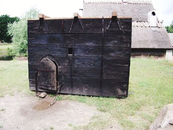 Abandoned building on field