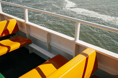 Orange benches on ferry