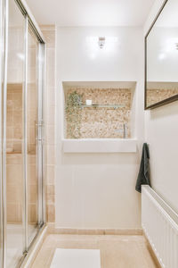 Low angle view of woman standing in bathroom