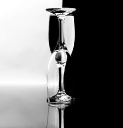 Close-up of glass of water against black background