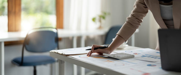 Midsection of man working at office