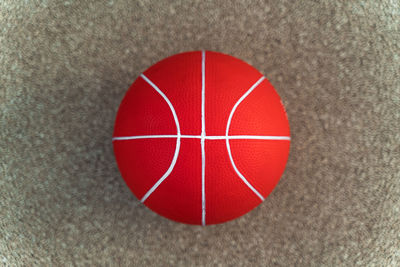 Close-up of red ball on wall