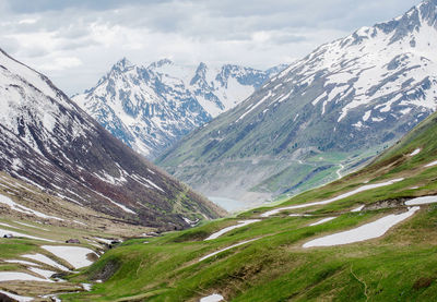 Scenic view of snowcapped mountains against sky