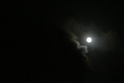 Low angle view of moon in sky at night