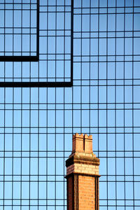 Low angle view of building against blue sky