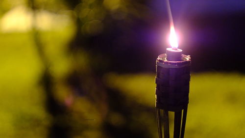 Close-up of illuminated lamp against blurred background