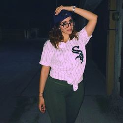 Portrait of young woman wearing sunglasses standing outdoors