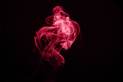 Close-up of smoke against black background