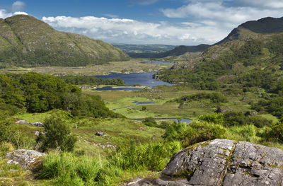 Scenic view of landscape and mountains against sky