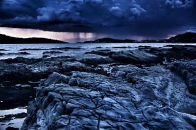 Close-up of waves on beach against sky