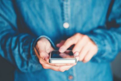 Close-up of person using mobile phone