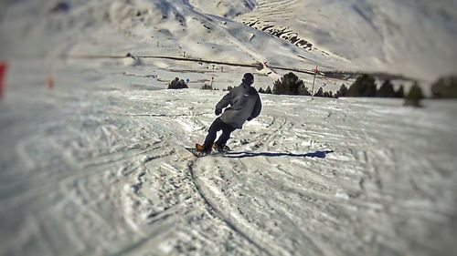 Full length of man skiing on snow