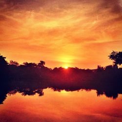 Scenic view of sunset over lake