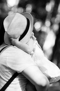 Rear view of person wearing hat