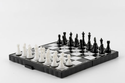 Panoramic shot of chess board against white background