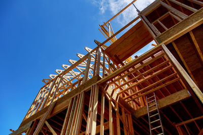 Low angle view of built structure against sky during sunny day