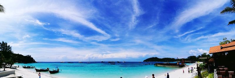 Panoramic view of sea against blue sky