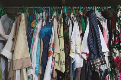 Clothes hanging in row at store