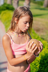 Young woman holding flower