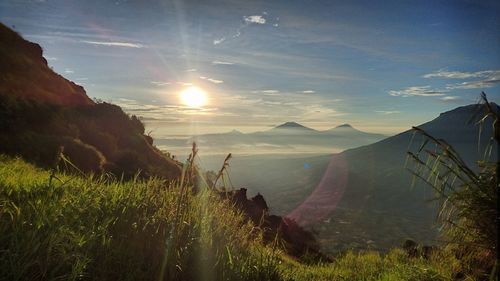 Panoramic view of landscape against bright sun