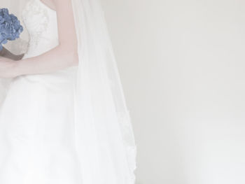 Close-up of woman over white background