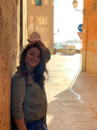 Portrait of a smiling young woman standing outdoors