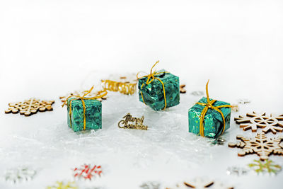 Close-up of christmas decoration on table against white background