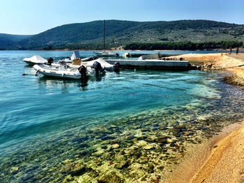 Scenic view of sea with mountains in background