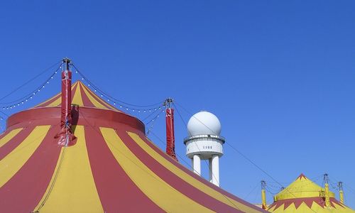 Low angle view of building against clear blue sky