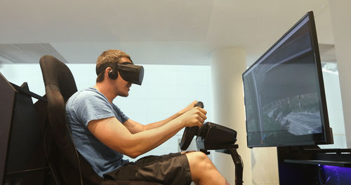 Man racing in vr headset