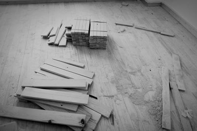 High angle view of wooden bench on table