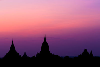 Silhouette of temple against sky during sunset