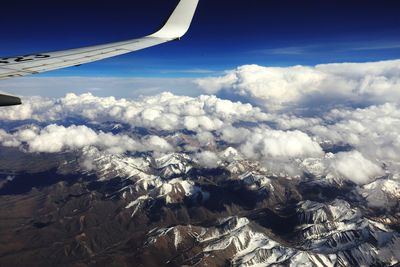 Aerial view of clouds over mountains