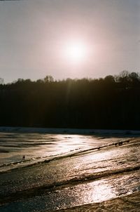 Scenic view of beach against sky during sunset