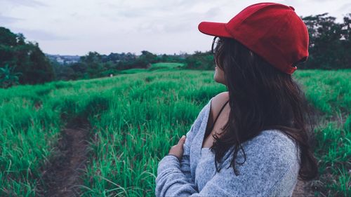 Woman wearing hat on field