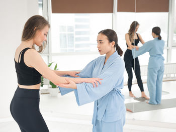 Side view of business colleagues shaking hands