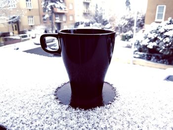 Close-up of coffee cup on table